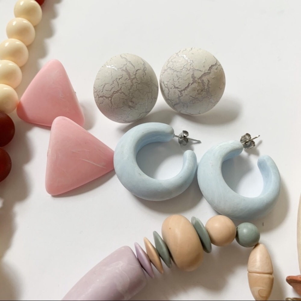 A bundle of wooden and clay jewelry